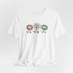 Embrace a touch of vintage charm with our Women's Vintage Floral T-Shirt, featuring a beautifully designed trio of flowers. This Comfort Colors tee offers a soft and cozy feel, perfect for any casual outing. The retro style and high-quality fabric make it a must-have for flower lovers and those who appreciate timeless fashion. Whether you're heading to a garden party or simply enjoying a relaxed day, this shirt combines comfort and style effortlessly. Add this unique floral tee to your wardrobe and celebrate your love for flowers in a chic, vintage-inspired way. .: Made with 100% Airlume combed and ring-spun cotton, a lightweight fabric (4.2 oz/yd² (142 g/m that is easy to layer, breathable. Perfect for active and leisure wear.  .: The retail fit that is perfect for casual and semi-formal Floral Tee, Flowers Design, Comfort Colors Tee, Chic Vintage, Flower Lover, Leisure Wear, Garden Party, Lightweight Fabric, Semi Formal