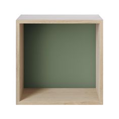 an empty wooden shelf with a green wall in the backgrounnd, for display purposes