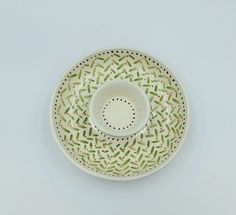 a white bowl sitting on top of a table