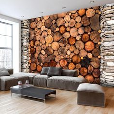 a living room with wood logs on the wall