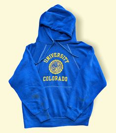 Vintage 1960s University Of Colorado Hoodie Sweatshirt Medium Velva Sheen 60s. Length 24 inches. Pit to pit 20 inches. Fits short. Has stains. Item Number S22-033. Vintage Blue Hoodie For Streetwear, Retro Blue Hoodie For Fall, Blue Vintage Hoodie With Drawstring Hood, Blue Retro Hoodie For Fall, Vintage Long Sleeve Hoodie With Drawstring, Vintage Blue Cotton Hoodie, Vintage Long Sleeve Top With Drawstring Hood, Vintage Streetwear Tops With Drawstring Hood, Retro Cotton Hooded Sweatshirt