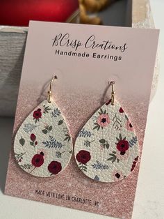 Celebrate the vibrancy of spring with these Floral Earrings. Crafted from faux leather in a teardrop shape, these small earrings feature a delightful combination of colorful flowers, making them the perfect accessory to add a touch of floral elegance to your summer style. Each pair is made for sensitive ears with hypoallergenic and nickle free hooks and a secure backing. Spring Trendy Teardrop Earrings, Trendy Teardrop Earrings For Spring, Spring Trendy Teardrop Jewelry, Spring Teardrop Flower Earrings For Pierced Ears, Trendy Teardrop Jewelry For Spring, Spring Adjustable Teardrop Earrings, Spring Multicolor Teardrop Jewelry, Spring Teardrop Earrings, Spring Multicolor Teardrop Earrings