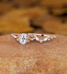 a close up of a diamond ring on a rock