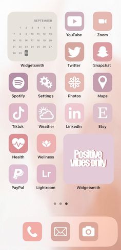 the pink and white phone screen is displaying icons