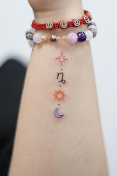 a woman's arm with three different bracelets on it and the word love written in