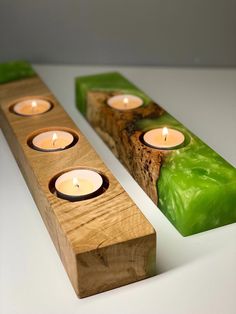 three wooden candles sitting on top of each other