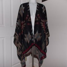 Mixit Tribal Print Cape Poncho One Size * 100% Acrylic * Measurements: From Shoulder To Hem In The Back = 33" * In Front, Drapes From Shoulder To Hem = 44" * From Mid-Neck To Arm = 26" Pre-Owned - Unworn Please See Pictures Tote4 20-0163t Black Bohemian Shawl For Fall, Black Bohemian Poncho One Size, Black Cape For Fall Festivals, Black Fall Festival Cape, Black Bohemian Cape For Festivals, Bohemian Black Cape For Festival, One Size Black Cape For Festival, Bohemian Black Poncho For Fall, Black Bohemian Poncho With Batwing Sleeves