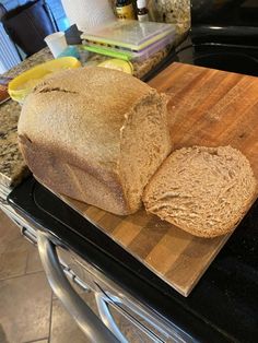 a loaf of bread sitting on top of a cutting board