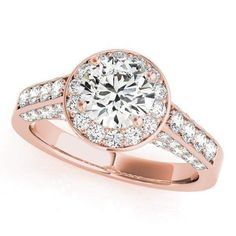 a yellow gold engagement ring with diamonds on the band and an oval shaped center stone