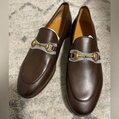 Never Used. Comes With Dust Bags But No Box Luxury Brown Gucci Loafers, Gucci Luxury Calf Leather Loafers, Luxury Gucci Calf Leather Loafers, Designer Brown Loafers With Horsebit Detail, Luxury Horsebit Loafers For Office, Classic Gucci Loafers For Evening, Classic Gucci Evening Loafers, Luxury Horsebit Loafers With Round Toe, Luxury Horsebit Loafers For Galas