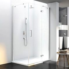 a bathroom with a walk in shower next to a table