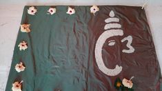 there is a large green banner with flowers and an ombrephant on it