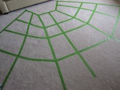 a living room with green lines drawn on the floor