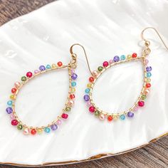 Colorful and light, everyday style hoops. 2” Spring Hoop Earrings For Everyday, Trendy Spring Dangle Hoop Earrings, Trendy Dangle Hoop Earrings For Spring, Spring Trendy Dangle Hoop Earrings, Summer Everyday Dangle Hoop Earrings, Hoop Jewelry For Everyday Spring Wear, Spring Hoop Jewelry For Everyday, Spring Hoop Jewelry For Everyday Wear, Trendy Hoop Beaded Earrings For Pierced Ears