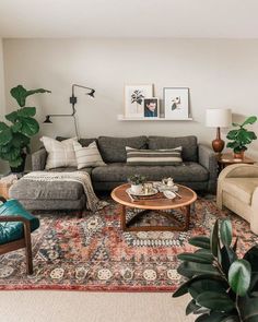 a living room filled with furniture and plants