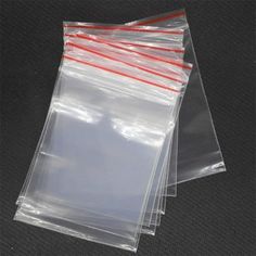 clear plastic bags with red handles and zippers