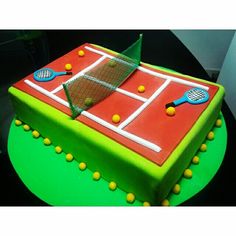 a cake that is shaped like a tennis court