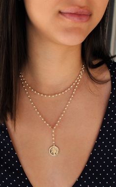 "This beaded necklace looks lovely as one long strand or wrapped around your neck for a layered look. \" WRAP MARIA LARIAT\" L E T S . T A L K . N E C K L A C E S ✤ Hand wiring with 14K gold filled wire or sterling silver wire ✤ Come in Swarovski pearl or Swarovski crystal Jet Black (photo 5) ✤ Medallions Pendents Gold Filled or Sterling Silver ✤ Model is wearing : photo 1 - 36\" Wrap around twice Photo 3 - 18\" Photo 6 - long necklace 36\" , short necklace 18\" Photo 9 - black crystal 16\" Phot Bohemian Lariat Pearl Necklace, Bohemian Lariat Pearl Jewelry, Bohemian Lariat Necklace With Pearl Chain, Beaded Layered Necklace For Festivals, Beaded Adjustable Layered Necklace, Single Strand Lariat Necklace With Round Beads, Adjustable Pearl Lariat Beaded Necklaces, Handmade Pearl Lariat Necklace, Adjustable Lariat Pearl Beaded Necklaces