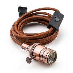 the copper and black cord is connected to a light