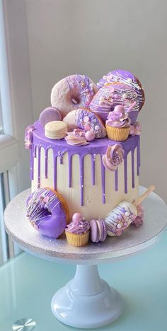 a purple and white cake covered in icing