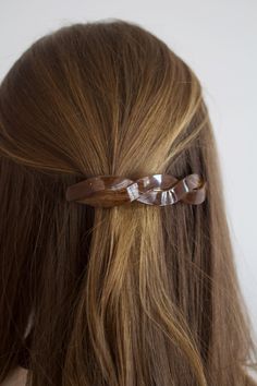 DESCRIPTION The Twisted Hair Pin is a stylish accessory to complete any look. Crafted from brown marbled acrylic for a unique look, its twist design and french barrette provide a secure hold. Perfect for all hair types and styles. Twisted Hair, French Barrette, Twist Hairstyles, Hair Pin, All Hair Types, Hair Barrettes, Hair Types, Barrettes, Stylish Accessories