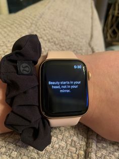 an apple watch with a text message displayed on the screen, sitting on someone's arm