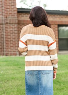 The Multi Striped Crewneck Sweater is a modest and fun way to switch up your sweater looks! Crafted using waffle sweater yarns with a multi stripe design, this crewneck sweater features a drop shoulder fit and a relaxed silhouette that hits below the waist! Style | Long Sleeve Color | Brown SIZING TIPS Fit | Loose Fit Stretch | None, Model | True to Size Trendy Striped Sweater With Ribbed Cuffs, Fall Striped Crew Neck Sweater, Striped Crew Neck Sweater For Fall, Striped Sweater For Layering In Fall, Trendy Fall Sweater With Ribbed Neckline, Trendy Sweater With Ribbed Neckline For Layering, Casual Striped Ribbed Cardigan, Striped Knit Sweater For Layering, Brown Knit Sweater With Ribbed Neckline