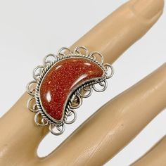 I Just Love The Mystical Glow Of Goldstone! This Is A Large Crescent Moon Stone Ring. I Had The Stone Specially Cut For This Design. The Goldstone Is Large And Nice And Thick. It Glitters So Much That Is Is Quite Stunning! This Is Set Into A Sterling Bezel That Is Framed With A Twisted Silver Wire Accent. Sterling Scalloped Loops Frame The Piece For More Detail. It Makes A Statement On Your Finger! ***This Is One Of Several Crescent Moon Pieces That I Have, So Please Check Those Out Too!*** Cond Nickel Free Sterling Silver Crescent Rings, Nickel-free Sterling Silver Crescent Rings, Nickel-free Crescent Sterling Silver Rings, Celestial Silver Crystal Ring As Gift, Celestial Style Silver Crystal Ring As Gift, Celestial Silver Crystal Ring Gift, Celestial Style Silver Crystal Ring Gift, Silver Crescent Crystal Ring For Gift, Crescent Moonstone Ring In Sterling Silver For Gift