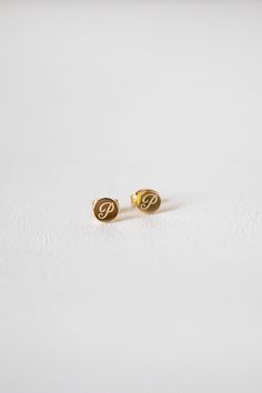 Personalise your accessories with the Initial Stud Earrings, a gold toned stud set with initial engraved details. Also make for the perfect gift!