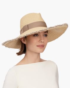 When shopping for a special occasion hat for sale online, Caroline, an elegant wide-brim fedora, will make an impression. It is suitable to wear for a wedding, Kentucky Derby, or an outdoor luncheon. This ever-chic style is made entirely of Squishee®, our unique man-made material, resembling natural raffia, which incorporates recycled fibers. The profile brim is wired beneath the narrow self-fringed edge, sweeping up on one side and gently sloping down on the other, to dramatic effect. A cotton Types Of Hats For Women, Caroline White, Summer Headwear, Special Occasion Hats, Packable Hat, Wide Brim Fedora, Straw Fedora, Love Hat, Cute Hats