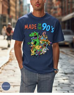 a man wearing a t - shirt that says made in the 90's