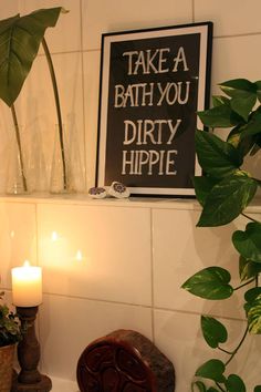 there is a sign that says take a bath you dirty hippie on the wall