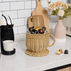 the kitchen counter is clean and ready to be used as a coffee maker, mugs, and other items