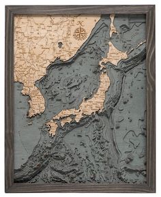 an old map is displayed in a wooden frame with water droplets on the surface and around it