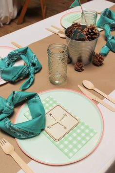 the table is set with napkins and place settings