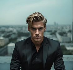 a man in a black suit sitting on top of a building next to a window