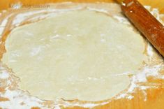 the dough is ready to be made into pizza crusts with a wooden rolling pin