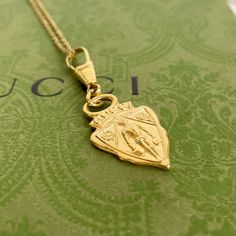 Vintage Gucci Gg Charm Pendant Necklace Authentic Vintage Gucci Charm Pendant 18” 18k Gold Plated Sterling Silver Necklace (Unbranded) Black Velvet Necklace Display Box (Unbranded) Color: Gold Pendant Size: Approximately 1” X 1.5” Chain Length: 18” Chain Width: 1.1mm Ships Same Or Next Day *This Is An “Upcycled” Item That May Have Minor Imperfections Including Light Fading And Wear. See Photos For Quality. Classic Yellow Gold Necklace With Logo Charm, Classic Necklace With Logo Charm For Gift, Classic Necklace With Logo Charm As Gift, Classic Logo Charm Necklace For Gifts, Gold Necklace With Logo Charm For Gift, Gold Necklace With Logo Charm As Gift, Yellow Gold Necklace With Logo Charm For Gifts, Yellow Gold Medallion Necklace With Logo Charm, Velvet Necklace