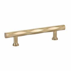 an antique brass finish pull handle with wavy lines on the top and bottom, for cabinet doors