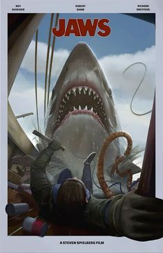 a movie poster for jaws with a man holding a large shark's mouth in front of him