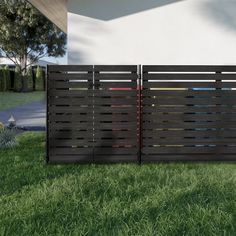 a wooden fence in front of a house