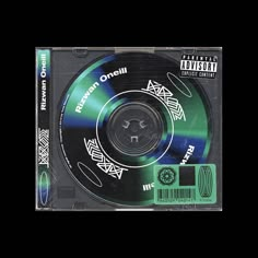 the cd is green and black with white writing on it