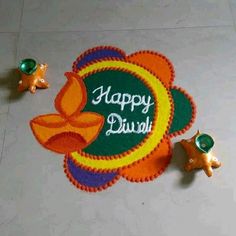 a happy diwali design on the floor with decorations