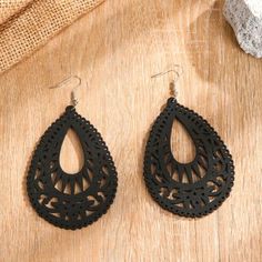 Women's Nwt Shein Black Teardrop Wooden Boho Earrings The Hollow Wood Design Adds A Natural And Earthy Element To Your Look While The Teardrop Silhouette Channels A Wonderful Bohemian Vibe. Incredibly Lightweight Ensuring All-Day Comfort Black Hue Makes Them A Versatile Accessory Silver Fishhook Ear Wires Feature Ball And Coil Accents Includes Clear Soft Rubber Earring Backs Eardrop Height 3.1", Width 2.2" Nwt. Never Worn. No Flaws Offers Welcome :) Pet And Smoke Free Home Bundle And Save! Model Handmade Black Bohemian Teardrop Earrings, Black Bohemian Teardrop Dangle Earrings, Black Bohemian Drop Earrings, Black Bohemian Pierced Jewelry, Black Bohemian Teardrop Earrings For Gift, Black Bohemian Teardrop Earrings As Gift, Black Dangle Teardrop Earrings For Party, Bohemian Black Teardrop Earrings As Gift, Black Dangle Jewelry For Festivals