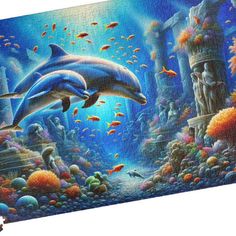 two dolphins swimming in the ocean with corals and other marine life around them on a puzzle board