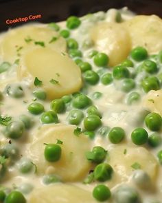 peas and potatoes are mixed together in a sauce