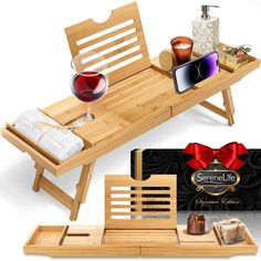 a wooden table topped with a tray filled with wine glasses and other items next to it