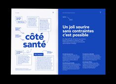 an open book with blue lettering on the front and back cover, in french language