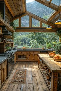 a kitchen with wooden floors and an open roof over the stove top oven, surrounded by greenery