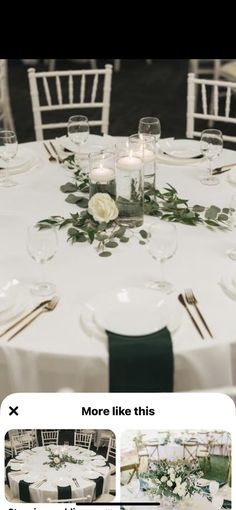 the table is set with white linens and greenery for an elegant wedding reception